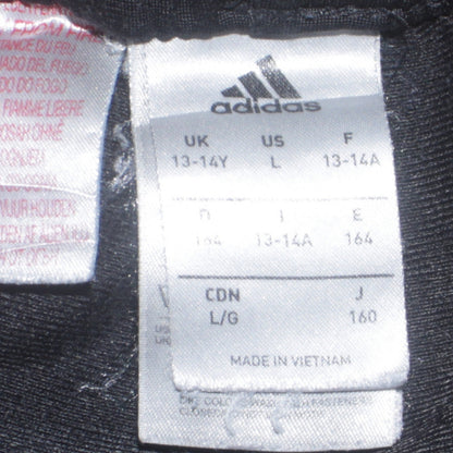 Close-up detail of adidas boys’ black 13-14 years track pants tapered fit sports trousers