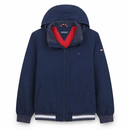 Front view of Tommy Hilfiger boys’ blue hooded windbreaker jacket, size 14, years