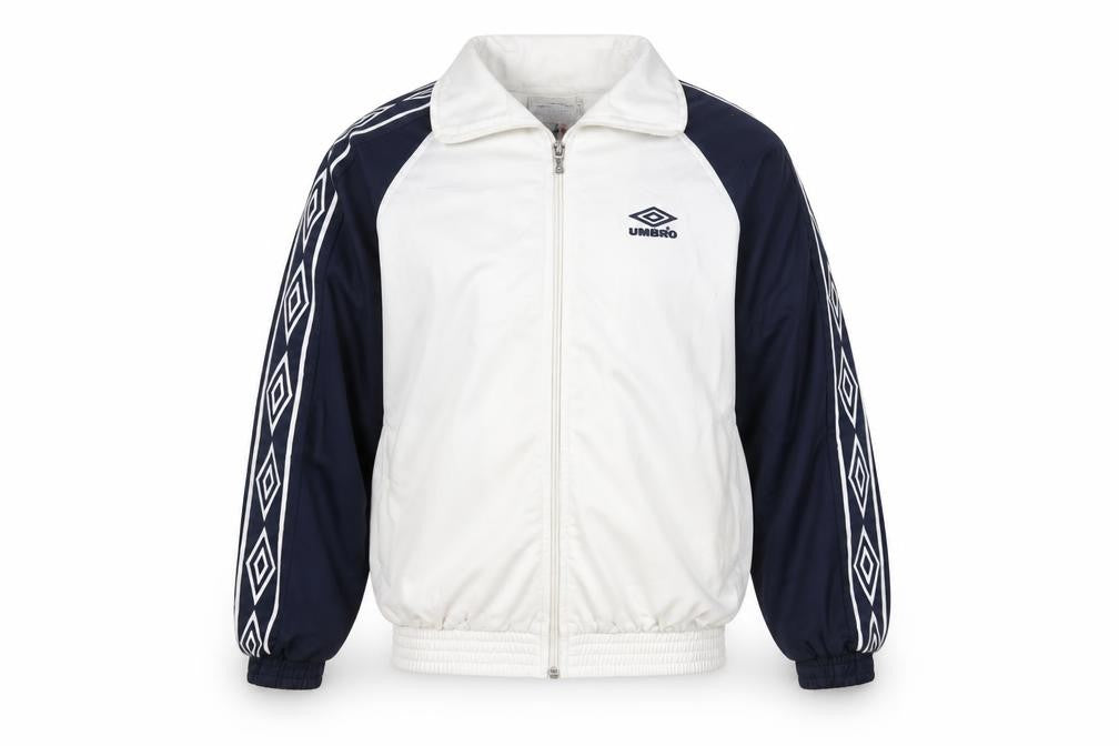 Front view of Umbro boys’ white blue track jacket 11 years full zip retro 90s sportswear