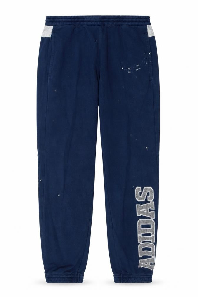 Front view of Adidas men’s blue jogger sweatpants, size M, elastic waist sportswear