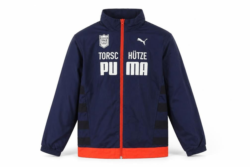 Front view of Puma boys’ blue windbreaker jacket 12 years lightweight full zip sportswear