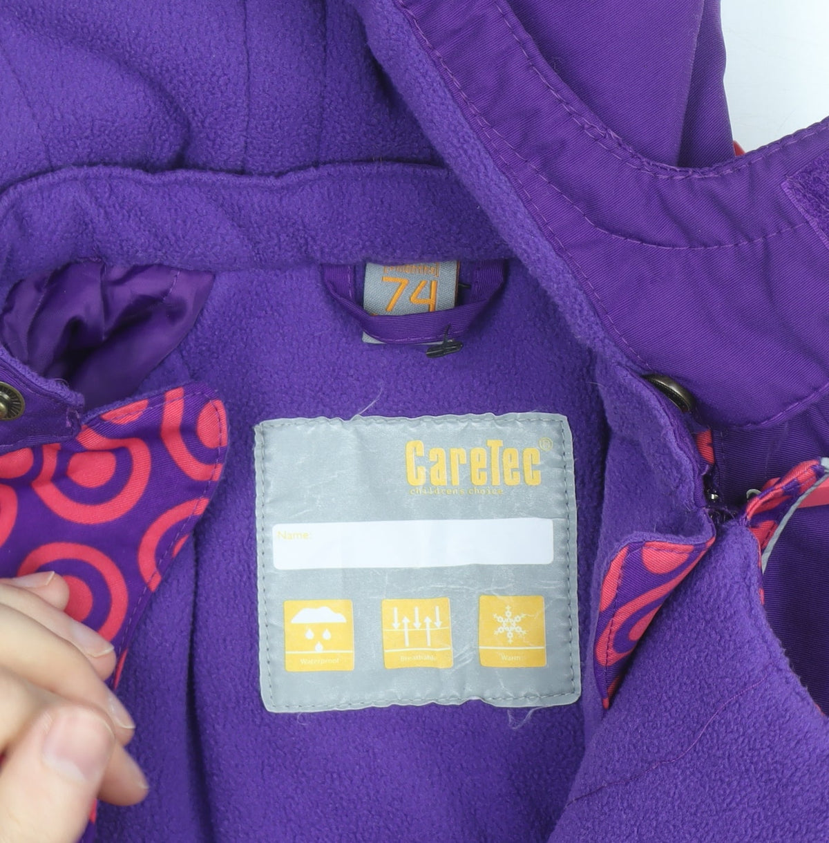Brand and care label for CareTec unisex baby purple waterproof hooded snowsuit 12 months winter outdoor