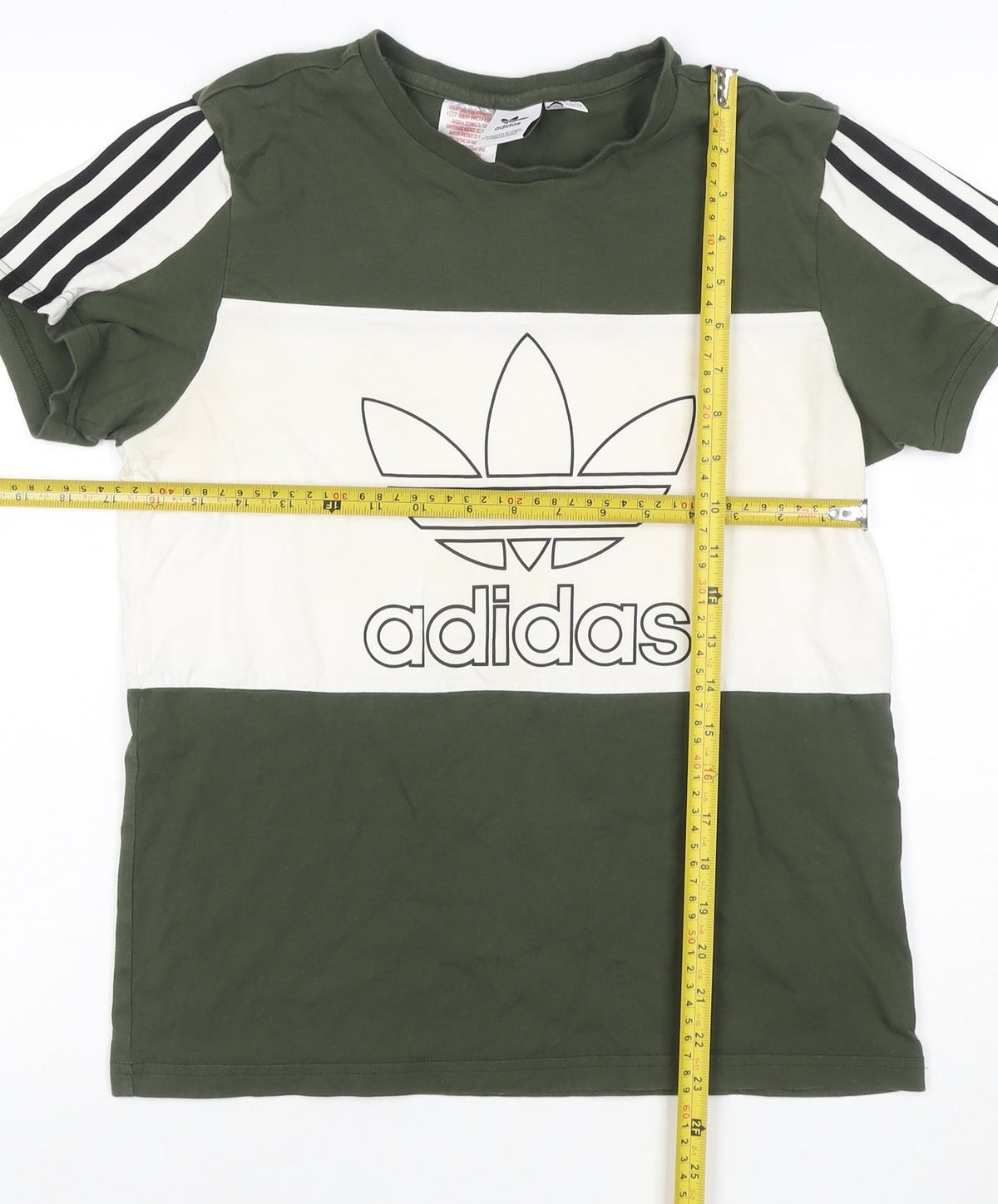 Close-up detail of Adidas boys’ green white 13-14 years logo colourblock jersey t-shirt