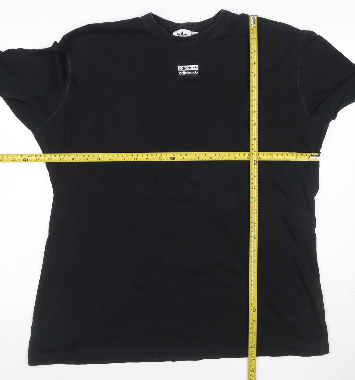 Close-up detail of adidas men’s black xl long sleeve logo graphic t-shirt