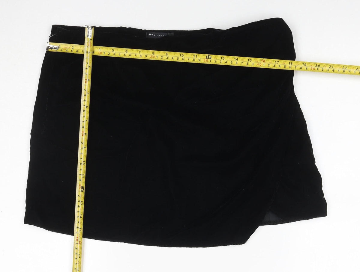 Close-up detail of ASOS DESIGN Women Black UK 16 Velvet Asymmetric Pencil Mini Skirt