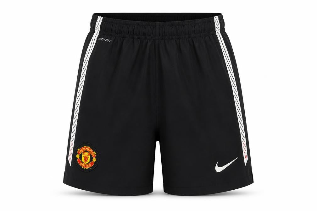 Front view of Nike boys’ black manchester united dri-fit football shorts 10-12 years