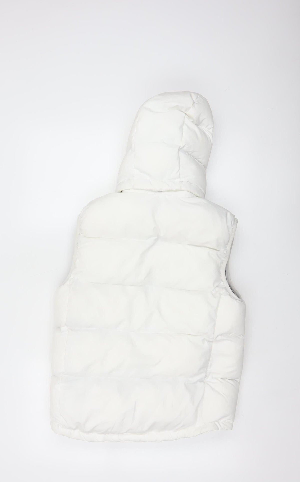 Brand and care label for Quechua girls’ white 12 years hooded padded puffer gilet waistcoat