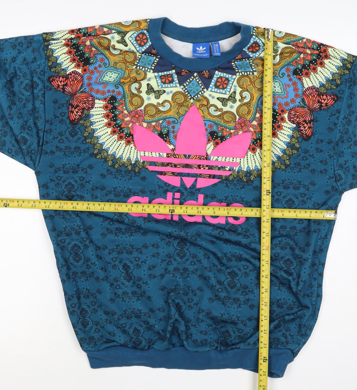 Brand and care label for Adidas unisex adults blue xs butterfly graphic logo crew sweatshirt