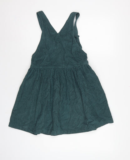 Brand and care label for Next girls’ green corduroy pinafore dress 7 years knee length cotton