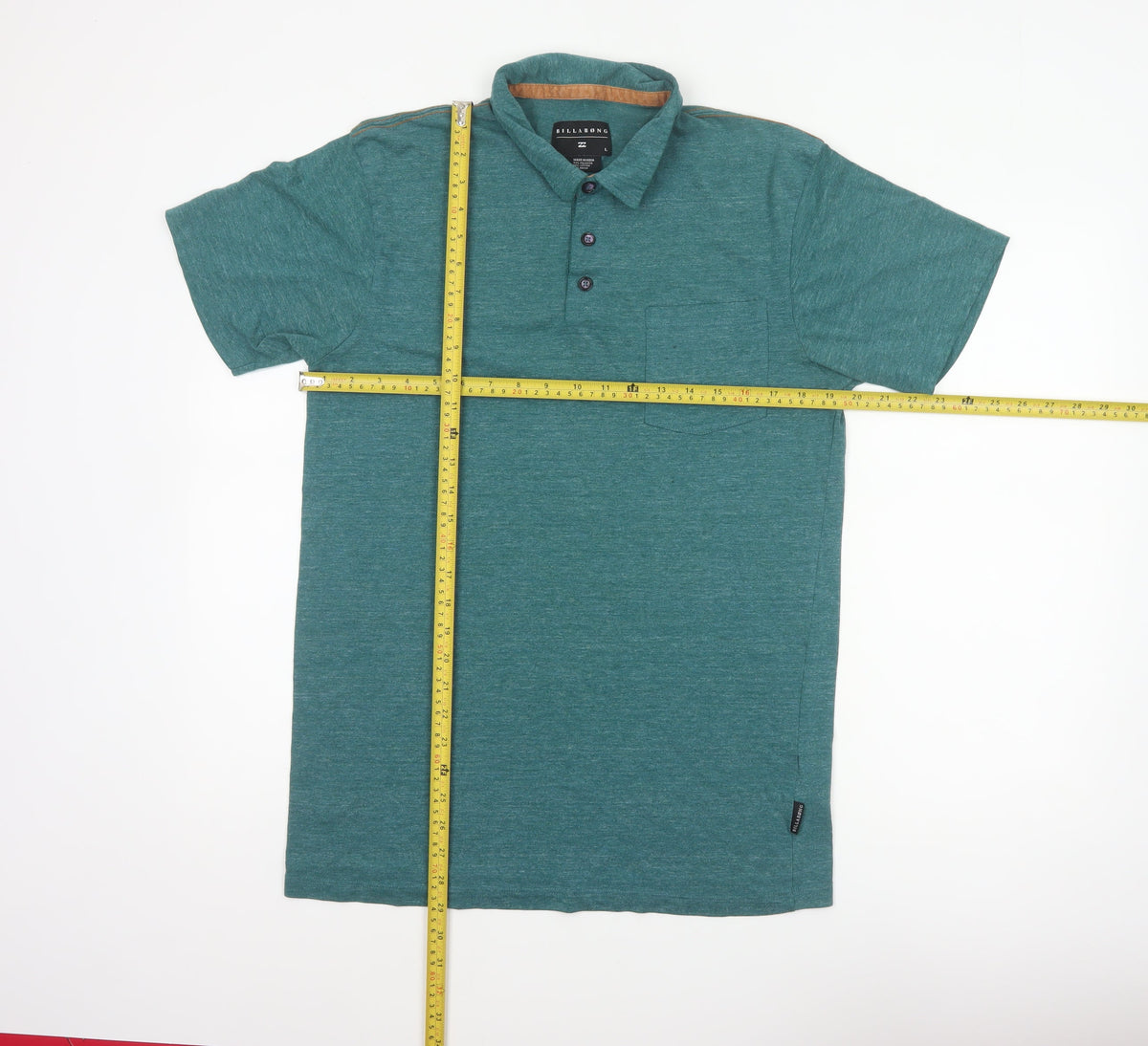 Close-up detail of Billabong Men's Green Marl Logo Pocket Polo Shirt, size L