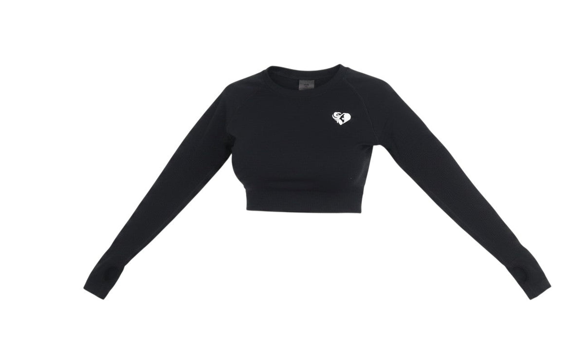 Prewornwholesale black long sleeve cropped activewear top with crew neck and thumb holes in a stretchy knit fabric.